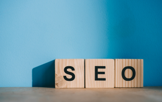 alphabet blocks with SEO word on blue background